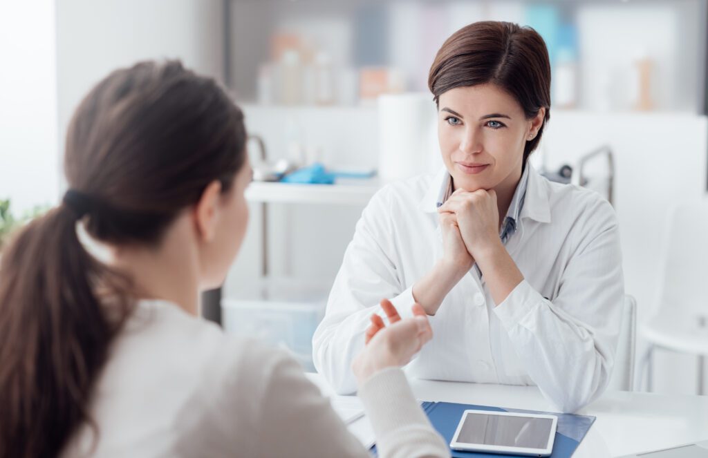 women talking with Botox provider to learn more about the treatment