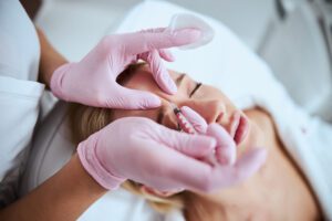 Woman receiving Botox for frown lines between eyebrows